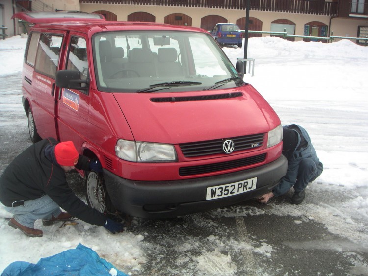 Putting on snow chains in December 2005